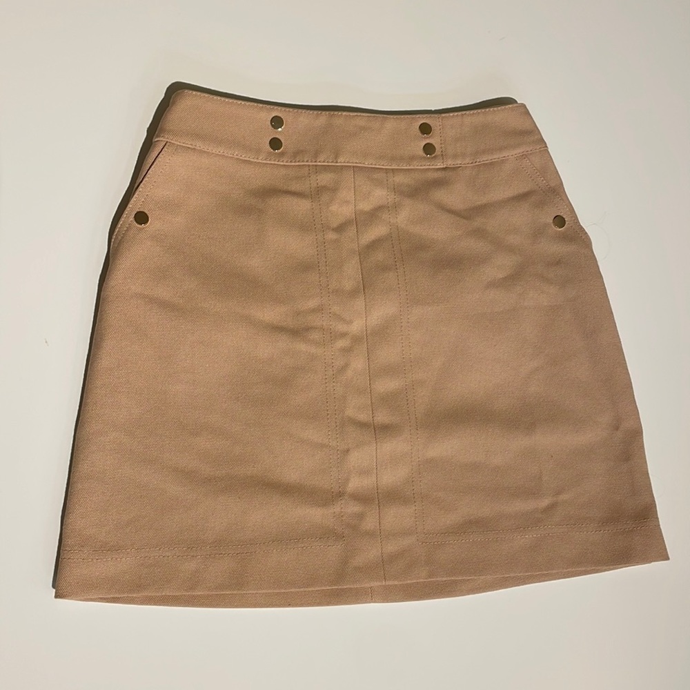 Tan mini skirt with gold accents ( buttons and zipper)